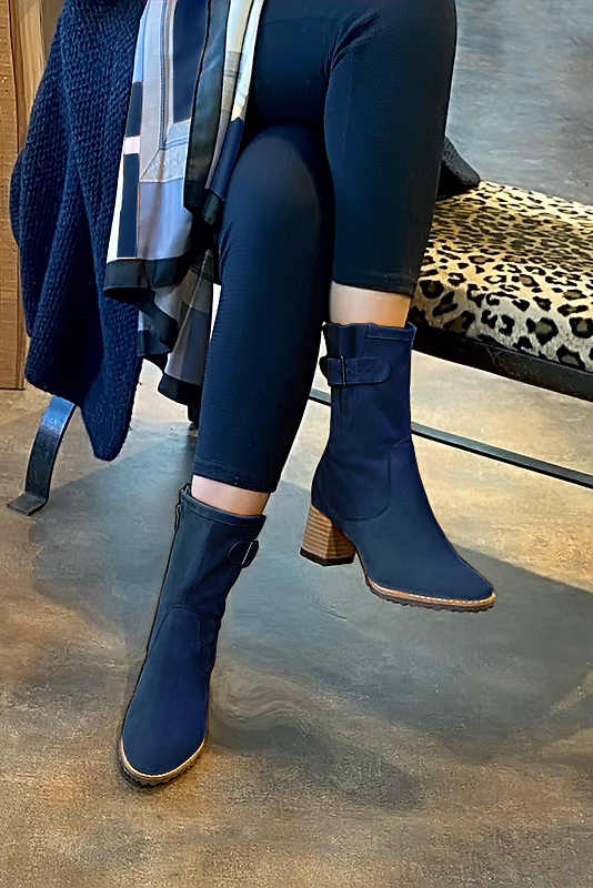 Navy blue women's ankle boots with buckles on the sides. Round toe. Medium block heels. Worn view - Florence KOOIJMAN